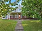 Charming Old-Style Farmhouse with 4+ Bedrooms on 2.4 Acres. This timeless colonial farmhouse blends historic charm with modern updates, offering 4+ bedrooms and 1.5 baths. A welcoming front porch leads into an inviting entrance hall with hardwood floors. The first floor boasts a formal dining room with original wide-plank pine floors, chandeliers, and crown molding, plus a formal living room(currently being used as a second dining room) with French doors, ceiling-to-floor windows, hardwood floors, and chandelier. The rear entry hall features a woodburning stove, cedar ceiling, recessed lighting, and French door to the outdoors, while a cozy sitting room offers hardwood floors and cedar ceiling. The spacious living room is filled with natural light, and the chefâ€™s kitchen is a true centerpiece with hardwood floors, cedar ceiling, large center island with Viking 6-burner stove and griddle, granite countertops, Sub-Zero refrigerator, Viking double oven, wine refrigerator, microwave, dishwasher, double sink, breakfast bar, glass-faced cabinetry, pantry, and floor-to-ceiling windows. Upstairs, the primary bedroom offers a cathedral ceiling, wide-plank floors, loft, recessed lighting, ceiling fan, walk-in closet, and an unfinished room ideal for a future en-suite bath. Additional bedrooms feature original wide-plank flooring, wall-to-wall carpet, built-in cabinetry, recessed lighting, ceiling fans, and crown molding. The full bath includes double sinks, linen closet, and a tub/shower. The outdoor spaces are equally impressive. Set on 2.4 landscaped acres, the backyard features a fenced-in inground pool, gazebo, and pergola with flagstone flooringâ€”ideal for entertaining or relaxing. A playground provides additional space for fun, making this property a perfect blend of charm, comfort, and recreation both inside and out.