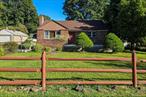 This solidly built, two bedroom, one bath ranch style home built in 1953 is set on a spacious, fenced and level .28 acre lot. Step inside to find a generous sized, light and bright living room with a wood burning fireplace {not used in nineteen years}. All original hardwood/wood floors on first level. A spacious eat in kitchen with original tongue and groove wainscoting adds rustic charm. There is a side door in the kitchen to the driveway and fenced level landscaped yard.; perfect for easy indoor-outdoor living. The attic is accessible with pull down stairs. Two comfortable bedrooms and full hall bath complete the main level. The lower level has a separate heat zone and is not included in the listed square footage.  The slate flooring is original and there is a laundry area with slop sink and mechanicals. Good versatile space ideal for a home office, gym or recreation area. and room for a possible additional bath. Situated in a quiet neighborhood just minutes to major roadways, metro north railway, shopping and the scenic riverfront. New furnace 2024, hot water heater 2022, roof, approx. 8 years, quarterly water bill approx. $100 in summer, $70 rest of the year. Electric; $230 per mo., Oil: 200 gallons 3x a year. Septic in the back of the house; pumped April, 2025, . Front steps and walkway repaired 2025. Window ac units not included. Underground oil tank in front. Tank system tested 07/31/2025,  No leaks detected. Report included in Documents. Tank should be repaired or removed as per tank inspection company. Seller is financially unable to address repair/removal of oil tank. It will be buyer&rsquo;s responsibility. This home, is sold, as is; where is, and is priced accordingly. Home inspection is for buyer&rsquo;s information only. This home offers so much potential; a wonderful opportunity for the next owners.