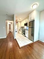 This beautifully renovated residence is set on the top floor of a brick townhouse in the heart of Forest Hills Gardens. Thoughtful updates blend comfort with convenience, including central air, new double-paned windows with custom shades, and in-unit laundry. The extended kitchen features ample workspace, while the richly finished wood floors add warmth throughout.The home offers excellent storage with an entry and linen closet, a fully renovated bath with tub, and a walk-in closet in the primary bedroom. The second bedroom accommodates a twin bed or functions perfectly as a home office or study.Enjoy proximity to parks, shopping, dining, Forest Hills Stadium, the West Side Tennis Club, and multiple transportation options. Convenient access to major airports adds to the appeal. Parking on the private Gardens streets is available by annual permit.