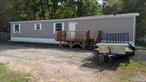 Renovated Mobile home. Single wide with 3 bedrooms, 2 full bathrooms and an open living room with kitchen and dining area. There is a laundry hookup off the kitchen. There is a large front porch and room for 2 cars. Landlord requires good credit, income and references. 1st months&rsquo; rent, security & fee with full application.