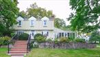 Located on a prime CORNER lot in the Village of Plandome, this charming residence sits on a generous 1/4-acre parcel. The home boasts a spacious cozy living room with a fireplace, a formal dining room, and a convenient 1st FL BEDROOM with a 3/4 BATHROOM. An additional sun-drenched sunroom features stone flooring and offers a tranquil retreat. Upstairs, a master suite, two additional bedrooms and a hall bath. The full basement offers potential for customization, while the flat backyard with a stone outdoor fireplace is ideal for entertaining. A rare-seen spacy high ceiling attached 2-car garage adds convenience, and the property is ideally located with easy access to the LIRR, local parks, shops, etc. Manhasset School District.