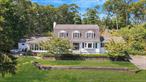 Welcome to this stunning, fully renovated (2022) dutch colonial home set on three-quarters of an acre in the heart of Smithtown, with a resort style backyard! Perfectly located within walking distance to vibrant Main Street and offering an easy commute with nearby LIRR access, this home combines convenience, luxury, and space! With over 2, 500 sq. ft. of living space above grade PLUS a full basement, this home delivers an incredible amount of room for everyday living and entertaining. Natural light pours in through the many windows, creating a warm and inviting atmosphere throughout. Inside, youâ€™ll find a formal living room with hardwood floors, bay window, and wood-burning fireplace, as well as an open-concept kitchen and dining area featuring white shaker cabinets, stainless steel appliances, quartz countertops, microwave drawer, and center island. A spacious family room with hardwood floors, crown molding, and a second woodburning fireplace offers the perfect gathering space. The third living room is truly specialâ€”vaulted ceilings, exposed beams, and walls of windows overlooking the backyard oasis make this a show-stopping retreat. Step outside to your private paradise with a heated saltwater gunite inground pool, paver patio, and separate entertaining area. Upstairs, the primary ensuite features hardwood floors, three closets, and a fully renovated primary bath. Two additional, generously sized bedrooms and a full bath complete the second level. The full basement provides endless options for a home office, gym, or additional living space, with interior access to the 1-car garage and an outside entrance to the driveway. The backyard is expansive and versatileâ€”whether you dream of gardens, play areas, or additional entertaining space, itâ€™s a blank canvas ready for your vision! New CAC, boiler, HWH, roof, appliances, pool heater, and salt cell! All of this in the Smithtown School District, making this home the perfect blend of location, lifestyle, and luxury! Taxes are being grieved!