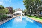 Located south of the highway, this fully renovated immaculate Westhampton gem is ready for summer of 2026. Featuring a bright open concept, the first floor consists of a kitchen, dining area with cathedral ceilings, living room, half bath, laundry room and two bonus rooms. The second level offers an en-suite, and master bedroom with a large bathroom & jacuzzi. The manicured backyard is ready to entertain your guests with a heated in-ground salt water pool, ipe decking, dining area and ample space for family activities. Dune Road beaches and Westhampton Beach Village are just minutes away! **AVAILABLE FOR: May ($20K)  June ($30K)  July ($40K)  August-LD ($40K)  September ($15K)  Memorial Day - Labor Day ($110K) **