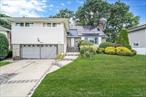 Located on a quiet, tree-lined street, this expansive split-level residence offers the perfect blend of comfort, space, and convenience. Just minutes from the Southern State Parkway, Meadowbrook Parkway, and the Long Island Railroad, commuting and travel are a breeze. Step inside to discover 5 generously sized bedrooms and 4 full bathrooms, including 2 private ensuites, real for extended family or guests. The bright and airy living/family room seamlessly flows into the formal dining room and eat-in kitchen, all bathed in abundant natural sunlight. Enjoy year-round relaxation in the enclosed sun porch, which opens to a beautifully landscaped, oasis-like backyard, perfect for entertaining or quiet evenings under the stars. A spacious flex room offers endless possibilities for a home office, gym, or playroom, and leads directly to the attached 2-car garage for added convenience. This home is a rare find, offering size, style, and a prime location. Donâ€™t miss the opportunity to make it yours!