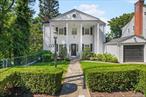 Welcome to 29 Chatfield Road, a Colonial in the coveted Longvale neighborhood of Bronxville. With an inviting front porch, and timeless curb appeal, this beautifully maintained home combines classic character with modern comfortsâ€”all within a short distance to Bronxville Village, shops, restaurants, and the Metro-North station for a quick 31-minute commute to GSC.Inside, the thoughtfully designed layout offers both function and charm. The heart of the home is a spacious, open kitchen that flows seamlessly into the dining area, creating the ideal space for hosting family and friends. The sun-filled living room features a cozy wood-burning fireplace, custom built-ins, and French doors opening to a large scenic deck with retractable awningâ€”perfect for outdoor dining and summer evenings.Upstairs, the primary bedroom boasts two closets and a private bath. Two additional bedrooms share a bright hallway accented by a charming window seat and sunset views, plus a full hall bath. Each bedroom is outfitted with custom closets and ceiling fans for year-round comfort.The finished lower level adds incredible versatility with a family room, home office, or guest suite complete with a half bath, laundry, abundant storage, and sliding glass doors to a second deck. Step outside to a private backyard with a patio, lush lawn, and a blossoming cherry tree in the spring.Additional highlights include a climate-controlled storage unit, an insulated and ventilated shed, and a one-car garage with new epoxy flooring. Professional landscaping and a paver driveway complete this exceptional home on a quiet, sidewalk-lined street.Enjoy the best of Bronxville living with community events, scenic trails along the Bronx River, and a warm neighborhood spiritâ€”right outside your door.
