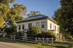 This beautifully updated farmhouse blends country charm with modern comfort with views of the surrounding farmland and the Catskill Mountains. The home features wide board wood floors, exposed beams, and abundant natural light. The main floor offers a living room, office, dining room, and a renovated kitchen with built-in banquette, opening to a mudroom. Upstairs, high ceilings and lots of light enhance four bedrooms, a full bath, and a dedicated laundry area. The screened porch, and back patio create seamless indoor-outdoor living. Outdoors, enjoy landscaped gardens, a pond, fire pit, mown walking trails, and open space to relax or entertain. A classic barn, two-car garage, and shed complete the property. Recent updates include solar panels, a heat pump, central A/C, and a new metal roof. Convenient to the Taconic Parkway, Amtrak, and Routes 9 & 9G, this is a true country retreat just 3 miles from Rhinebeck Village.