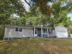 One level living at its best! This spacious country home was remodeled/ updated in 2022 and features LR w/ stone fireplace, sunny kitchen w/ stainless steel appliances (including wine fridge), Dining area, spacious primary bedroom suite w/ full bath, 2 additional bedrooms & another full bath. Enclosed/ heated rear porch is perfect for home office, den or reading room. Partially finished lower level offers a large, finished room for family room, home gym, play area etc. The home also features a large attached 2 car garage, open air deck and backyard with space for children & pets and even a vegetable garden. Estimated square footage shown includes enclosed/heated porch & partially finished lower level. Close to school, shopping, farmers market, Bethel Woods, the Delaware river, area lakes, skiing, hiking and more! Add this spacious beauty to your MUST SEE list!