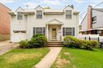 Nestled in the highly sought-after Pelham Parkway area of the Bronx, this diamond in the rough is ready for a skilled and loving homeowner to restore its charm and unlock its full potential. This exquisite Dutch Colonial home features an elegant Greek revival portico and is located on a sprawling 50x100 lot. Gated front yard with driveway and garage parking. Large backyard perfect for connecting with nature or family. Close proximity to parks, hospitals, and transportation options, including the #5 & #2 subway line and express buses offering quick access for Manhattan commuters. On the inside, this home welcomes you with a formal living room on the left of the house and a formal dining room adjacent to an open kitchen on the right-hand side. A U-shaped kitchen offers plenty of counter space for a multitude of scenarios - from cooking to entertaining. Three generously sized bedrooms are complete with ample closet space and allow for plenty of natural sunlight. The upstairs bathroom is also well-sized and features a skylight. The utility basement has high ceilings with both internal steps leading to the main floor and egress to the back yard through a separate entrance. DEVELOPER POTENTIAL - The 50 x 100 double lot footprint with R4A zoning and a Max FAR of .75 should allow for additional potential living sq. ft. up to 3, 750 sq. ft. (5, 000 sq. ft. footprint x Max FAR or .75 = 3, 750 sq. ft. of living space; enough for potentially two 1, 875 sq. ft. 2-family homes, assuming no additional zoning restrictions apply â€“ building potential must be independently verified with your architect or other zoning professional.)