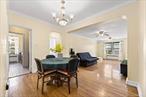 Welcome to this spacious, well-maintained, and bright pre-war one-bedroom, one-bath apartment in Jackson Heightsâ€”one of NYCâ€™s most desirable historic neighborhoods. The building is conveniently located just two blocks from the 74th Streetâ€“Roosevelt Avenue/Jackson Heights transit hub, making it a commuterâ€™s dream. Nearby, youâ€™ll find a wide array of restaurants, caf&#233;s, supermarkets, banks, shops, and pharmacies. The building is well-kept with strong financials, and this apartment offers very low maintenance. Schedule a tour today before itâ€™s gone!With 782 square feet on the 5th floor, this apartment offers great light with a thoughtful layout and excellent energy flow. Step through the front door into a welcoming foyer that opens to a dining area with seating for six to eight, plus two spacious closets. A step down leads to the sunken living room, featuring 8.5-foot ceilings, elegant Art Deco moldings, and two oversized windows overlooking the buildingâ€™s lush garden. Original hardwood floors run throughout the dining area, living room, and bedroom, while freshly painted walls and ceilings brighten the space.The fully equipped eat-in kitchen includes generous counter space, and ample cabinetry with airy windows.The beautifully all subway-tiled bathroom features a soaking tub and a nice sink, with warm tones that evoke a spa-like atmosphere.The large bedroom, with three windows, easily accommodates a king-size bed.Additional highlights include two ceiling fans in the living room and four closetsâ€”coat, bedroom, linen, and storageâ€”for exceptional organization.Montclair Gardens is a pre-war cooperative apartment residence in the historic garden district of Jackson Heights. It has a live-in superintendent, a common garden area, elevators, laundry rooms, and a party room/communal space. The monthly base maintenance is only $663.55 and pets are allowed, as is sub-leasing with Board approval. Storage bins and bicycle storage are also available.