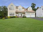 Welcome home to this elegant four bedroom colonial gracing a quiet cul-de-sac in the Streamside Knolls community. From the moment you arrive, the covered entry and grand center hall foyer set the tone for timeless sophistication and warmth. Inside, the open concept design presents a spacious living area with beautiful hardwood floors and a cozy gas fireplace. The primary suite is a true retreat, featuring vaulted ceilings, dual walk in closets, and a luxurious ensuite bath. A full walkout basement offers an additional 1, 245 sq ft. of versatile space and endless possibilities. The beautifully landscaped backyard provides complete privacy with lush gardens and multiple seating areas, while the oversized deck invites you to relax or entertain with serene wooded views. Additional highlights include an oversized two-car front entry garage, central vacuum system, and impeccable maintenance throughout. Streamside Knolls is a mature and vibrant community across from Heritage Financial Park. Residents enjoy exceptional amenities including a clubhouse, swimming pool, childrenâ€™s pool, tennis and pickleball courts. The neighborhoodâ€™s welcoming atmosphere is enhanced by tree lined streets and a true sense of community. Ideally located just three miles from the Metro North train station and close to major highways, a rare blend of privacy and proximity makes this address truly special.