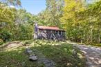 A fabulous 1BDR/1BTH cabin can be found nestled on a 30 acre estate in Holmes NY. A large stone fireplace with a wood burning stove anchors the large open living room. Hardwood floors throughout the house, all the windows have been replaced with double glaze and screens to increase energy efficiency and it was freshly painted. The year round sunroom makes a great home office or Yoga studio. Out the front door is a path leading to Ballard Pond on the property, where you will find a bench, dock and canoe to enjoy the great outdoors. A private back deck allows you to be one with nature as you enjoy the peace and quiet and of this one of a kind rental.