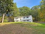 *OPEN HOUSE 10/18 noon-2pm* This beloved 3BR/1.5BA home is conveniently located yet, tucked away on 0.81 acres surrounded by trees in a sought after neighborhood minutes away from the TSP and Rte 82. Set perched on a hill, this home is set back off the road and within view of beautiful mountain sunsets which can be enjoyed from the expansive, oversized bay window that also floods the living and dining rooms with natural light. The warmth of this home is felt upon entering with many original details such as the ornate banister, hardwood floors, wooden cabinetry, decorative coat closet and other originalality throughout. The eat-in kitchen features a built-in oven, cook top and plentiful cabinetry. The kitchen sink overlooks the wooded backyard and brand new patio (9/25). The full bathroom and 3 bedrooms complete the main level and the basement is partially finished with a walk-out, half bathroom, utility room with washer and a two car garage. There is also ample paved parking. Brand new septic system (7/25). Roof replaced in 08/18 with architectural shingles. All municipalities cleared, can close quickly. Selling as-is.