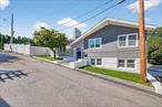 Step into this beautifully renovated 3-bedroom, 2-bath home offering modern updates and comfortable living in a prime Yonkers location. Every detail has been refreshed from top to bottom, creating a move-in ready space with warm natural light and stylish finishes throughout. The spacious lower level provides a versatile layout perfect for entertaining, a family room, or even in-law use, adding exceptional flexibility for todayâ€™s lifestyle. Outside, youâ€™ll find a welcoming yard and neighborhood setting, just moments from shopping, schools, parks, and convenient commuting options into New York City. This home is a perfect blend of value, functionality, and modern livingâ€”ready to enjoy from day one.Inside, the updated kitchen shines with quartz countertops, custom cabinetry, and a classic white beveled-edge subway tile backsplash, seamlessly combining function and style. The kitchen opens to a formal dining space and sliders to a covered outdoor dining space, both perfect for entertaining large crowds. A stunning stone fireplace with a modern insert anchors the living space, while fully renovated baths in sleek neutral grays provide a fresh, spa-like feel. Lower level offers multiple zones- mudroom, laundry, full bath, home gym and two recreation rooms perfect for guests, in law use or work from home especially with separate entrance both at the rear and off the expansive paver stone driveway. Outdoors, multiple patio levelsâ€”including a covered area, herringbone Trex decking area surrounding above ground pool with views of all of Yonkersâ€”offer a variety of entertaining zones for summer barbecues, quiet relaxation, or gatherings with family and friends, making this home truly exceptional inside and out.