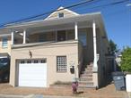 Private Beach Community-Long Beach/East Atlantic Beach -Lovely Spacious 1 Bedroom w/Walk in closet, State of the Art Kitchen, Cathedral Ceiling, Tiled Bathroom, Wood Floors Thru out, Radiant Heat, CAC, Washer/Dryer, Window Treatment, Central Vac, Speakers in Ceiling,  Out Door Shower,  Front Porch, Driveway, Utilities included Must See!!!,