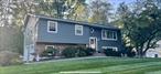 Welcome to this beautifully Renovated 4 bedroom, 2 1/2 bath home in sought-after neighborhood within the Clarkstown School District. This home checks off all the boxes. Walk into your sun-drenched renovated kitchen with Kraft maid raised panel cherry soft close cabinets, stainless steel appliances, quartzite fantasybrown countertops, cracked glass subway tile backsplash, center island with loads of storage with a quartzite top and overhang for seating, oversized sink, full length windows, ceiling fan and gleaming H/W floors. The kitchen flows into dining room through opened area with French doors leading out to Trex like deck withSun Setter retractable awning perfect for morning coffee, grilling, entertaining and relaxation. On this level, you will find large living room, H/W floors throughout as seen, three comfortable bedrooms with ceiling fans along with a fully renovated hallway bath with neutral porcelain tiles, harlequin design, upgraded delta fixtures, and Jacuzzi type tub. A fully renovated ensuite primary bathroom in primary bedroom with stall shower porcelain tile, all new fixtures, delta faucets, and exhaust fan. Upper level accented by elegant crown molding and a warm, neutral palette, H/W floors, new pull-down attic stairs and a new stained oak railing with solid/twist iron with a newly tiled floor leading to the lower level with a brick fireplace in cozy family room, fourth bedroom with lavatory, washer/dryer, walk in closet. 4th bedroom currently being used as home office has separate entranceway leading out to large patio and walkway. House also has central air upstairs and down and a 2-car garage. The exterior of home with loads of renovations and upgrades including a 200 amp service, insulated windows, oversized concrete patio, Newly Vinyl sided with CertainTeed oversized shingle front & Dutch lap, oversized leaders/gutters w/gutter guards, all newer exterior lights and GFI outlets, new freeze proof water Spigots, Newer driveway just recently sealed, Professional landscaped with level private backyard just waiting for you!