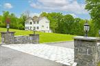 Tucked right outside the village of Red Hook, is the lovely neighborhood on Broadview Lane, where you have the unique luxury of extensive private acreage but also enjoy the community setting. This custom colonial is both elegant and cozy; it has been carefully curated with immaculate details featuring crown moldings, recessed lighting, and beautiful hardwood floors. Welcome your guests into the grand entrance way with 20 foot ceilings and loads of windows, making it a light and bright floor plan. To the right a great living room features a handsome stone hearth with gas fireplace, leads into the massive eat in kitchen with custom knotty pine island and breakfast bar, stainless steel appliances and new double oven. Perfect for entertaining and nights doing homework while cooking dinner. Dining room is open and flows off the kitchen for whatever your needs are for entertaining in a formal dining room currently or larger living area for lounging. Powder room off kitchen for convenience and laundry room tucked off kitchen with butler&rsquo;s pantry. Back deck off the kitchen with new trek decking for al fresco dining and enjoying your coffee with the sounds of the birds. Upstairs there&rsquo;s a lovely landing for curling up with a book next to the massive picture window, the primary suite is to the right with walk in closet, ensuite bathroom features a soaking tub, double sinks, shower and water closet. Plenty of space for optimal comfort. Two great sized bedrooms on this floor, guest bathroom with double sink and bonus flex room for office or guests. Attic for storage has walk up entrance on each side of home, features custom lighting for easy and efficient storage space. The lower level is finished for recreation, guests or lounge space; with glass sliders out to the back yard. Bathroom on this level for convenience, walk into a massive ceramic tiled garage with heat and plenty of storage space. Back up generator for peace of mind and security. Outside we have over 6 acres of beautiful green yard space, perfect for a pool, gardens, or play space. All this on the sweetest cul de sac perfect for morning walks or bike riding. 10 minutes to Red Hook village, 15 minutes to Rhinebeck and 4 minutes to the TSP for easy travel.