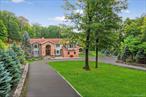 Tucked far back from the road, down a sweeping drive, this completely remodeled custom Colonial redefines what it means to entertain at home. A secluded retreat set on 5 acres of total privacy, you may never want to leave.Step inside to a grand two-story foyer, flooded with natural light from an oversized Palladian window and anchored by a striking mahogany staircase with sleek metal rails. To one side, a front-to-back formal living room offers flexible space for both work and relaxation, while on the other, a formal dining room opens seamlessly to the heart of the home: a chefâ€™s kitchen.Here, custom maple cabinetry with oak trim pairs beautifully with professional-grade appliances â€” including a 48â€ Sub-Zero refrigerator and a suite of Viking pieces. A large center island provides seating for six, while an adjoining prep area and summer kitchen make hosting effortless. Just beyond, sliding doors reveal the true showpiece of this property: an outdoor oasis with a 20â€™ x 40â€™ inground pool, massive paver patio, pavilion, outdoor kitchen with built-in Lynx grill and vented hood. There is also a raised firepit for rotisserie cooking, and direct access to the walkout lower level.The two-story great room, with its soaring windows and dramatic floor-to-ceiling stone fireplace, frames views of this backyard haven, filling the home with warmth and light.Upstairs, the private guest suite above the garage offers a living room with tray ceiling, office nook with balcony, spacious bedroom with walk-in closet, and a full bath â€” a first-class retreat for visitors. The primary suite showcases Brazilian cherry floors, tray ceiling, custom walk-in dressing room, and a spa bath with jetted tub, towel warmer, and an oversized shower with body jets and rain head. Two additional bedrooms with maple floors share a beautifully appointed hall bath with heated towel racks and bidet.The finished lower level includes a family/game room with exposed beams that offer a refined, rustic feel. On the opposite side of the basement, a custom wet bar stretches 18â€™ and looks through to a bonus room. These two spaces will certainly be a place where friends gather and games are watched. Laundry/mudroom, and gorgeous full bath complete this level. Thoughtful upgrades include radiant heat, two zones central air, high ceilings in the garage with porcelain-tiled floor, a new expansive driveway with parking for six, and a defined entry sequence that enhances the estate-like feel.This is more than a home â€” itâ€™s a lifestyle. Private, luxurious, and designed for gathering.