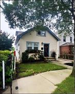 Charming four-bedroom Cape Cod-style cottage located in the heart of Franklin Square, featuring a spacious foyer and mudroom to meet all your needs. The property is move-in ready. The living room includes an electric fireplace and a smart thermostat. The first floor offers a bedroom and a versatile office space that can function as a bedroom. The updated kitchen is equipped with smart stainless steel appliances, pull-out drawers, spice racks, garbage bins, a gesture-controlled range hood, and a bright dining area. The modern bathroom has been recently renovated for added luxury. Upstairs, there are three generously sized bedrooms with ample storage space. This home is conveniently situated near numerous amenities, including public transportation along Hempstead Turnpike, and Polk Street Elementary School. The property also features a full unfinished basement with an outside entrance, a gas boiler, a new water heater, and a new large-capcapacity smart washer and dryer.
