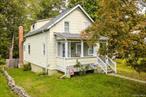 Charming 1920â€™s Bungalow in the Heart of Walden Welcome to 40 Sherman Ave, Walden NY â€” a cozy and quaint bungalow/Cape Cod-style home nestled on a quarter-acre flag lot that opens wide in the back, offering both privacy and potential. With just under 1, 300 sq. ft. of living space, this 3-bedroom, 1-bath home is the perfect starter or downsize opportunity. Step inside and youâ€™ll immediately notice the original character throughout, including built-in shelving, beautifully engraved wooden stair rails, and hardwood floors across both levels. The main floor features a warm and inviting living space, a bedroom for convenience, a cozy kitchen with an eat-in area or option for a formal dining room, and a covered side porch just off the kitchen â€” perfect for morning coffee or evening relaxation. Upstairs, youâ€™ll find a full bath and two well-appointed bedrooms, each with its own charm. Additional details like radiator heat and classic floral wallpaper add to the timeless character of this 1920â€™s gem.Enjoy the welcoming covered front porch or head to the backyard, accessible through the walk-out basement, which provides ample space and endless possibilities for outdoor entertaining, gardening, or play. Recent updates within the last 5 years include a new roof, new water heater, and new boiler, providing peace of mind for the next owner. Located in the desirable Valley Central School District, this home is set in a walkable neighborhood with easy access to shops, dining, and local attractions. Commuters will appreciate the nearby bus station to NYC within walking distance, or a convenient 1.5-hour drive. Lovingly cared for over the years, this classic Hudson Valley home is ready for its next chapter. With a little updating and TLC, itâ€™s a fantastic opportunity at a great price.