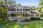 This beautifully maintained Colonial, built in 2001, offers over 3, 000 sq ft of living space on 1.37 acres at the end of a quiet cul-de-sac. Inside youâ€™ll find gleaming hardwood floors throughout, central air, and a thoughtfully designed layout featuring 4 spacious bedrooms, 2 full baths, and 2 half baths. The main level flows effortlessly from a bright entryway into a generous living room, formal dining area, and an eat-in kitchen perfect for gatherings. Upstairs, the primary suite offers a large walk-in closet and a private en-suite bath, while three additional bedrooms provide ample space for family, guests, or a home office. The home also includes a finished basement, providing additional versatile living space, perfect for a media room, gym, or playroom. Step outside to a large deck overlooking the private backyard, a great spot for entertaining or simply relaxing in the quiet setting. Additional highlights include an attached two-car garage, plenty of storage, and curb appeal enhanced by the end-of-cul-de-sac location. All of this is located just 3 minutes from the Taconic Parkway, making it ideal for commuters while still offering privacy and peace. This Colonial blends space, comfort, and convenience in one of the most desirable locations.