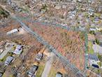 Builders, developers, and dreamers â€” hereâ€™s your chance! This expansive 2.8-acre wooded lot is located in a desirable residential neighborhood within the Mt. Sinai School District, surrounded by beautiful homes and already connected to public sewers for added convenience.Zoned A1 Residential with approx. 122, 839 sq. ft, this property offers incredible potential: subdivide into multiple lots, design new homes, or explore town-approved development opportunities like townhouses or condos.Whether youâ€™re looking to create a thriving new community or make a smart investment, this is a rare find in a highly sought-after location.