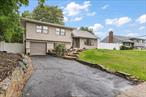 Welcome to 6 Nowick Lane, nestled in the desirable Legend Woods community of Smithtown. This completely renovated split-level home offers modern living with timeless style. The open-concept main level features a custom kitchen with modern finishes and solarium-style windows that fill the space with natural light while overlooking the private, landscaped yard. The primary suite offers a spa-like bathroom including a jacuzzi tub. With 3 full bathrooms throughout, this home is designed for comfort and convenience. The lower level provides a spacious family room and an additional full bath, perfect for multi-generational living or guest accommodations. Move-in ready and designed for todayâ€™s lifestyle, this home combines elegance, versatility, and privacy in one of Smithtownâ€™s most sought-after neighborhoods.