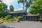 Nestled at the end of a quiet cul-de-sac on a sprawling .64-acre lot, this stunning mid century modern cape has been meticulously renovated from top to bottom. Every detail has been thoughtfully considered, from the high-end finishes and custom millwork to the refreshing and tasteful use of color throughout. With its adaptable layout and luxurious amenities, this home is perfect for downsizers or upsizers alike. The living room features a beautiful fireplace flanked by custom built-ins that create a cozy and sophisticated atmosphere. The chef&rsquo;s kitchen is a dream, boasting all the bells and whistles and a dedicated dining area with a large picture window looking out to the private deck and treetop views. The main level also features a luxurious primary suite, offering a private and serene retreat. In total, the home offers four bedrooms and four full bathrooms. The lower level provides an additional 640 square feet of beautifully finished space, bringing the total finished square footage to 3, 012. This versatile walkout level includes a family room, a full bath, wine storage, and a well-appointed laundry room, mudroom, and access to the large 2 car garage.