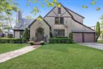 Welcome to 37 Massachusetts Blvd, located in the vibrant Bellerose Village in Floral Park. This enchanting Tudor-style home, crowned with a durable slate roof, offers classic charm.As you step through the front door, you&rsquo;re greeted by an impressive living area. Vaulted, beamed ceilings stretch above, creating a sense of grandeur and space. A cozy fireplace serves as the room&rsquo;s centerpiece, inviting you to gather around on chilly evenings. Overlooking the living room, a second-floor Juliet balcony adds an elegant touch, offering a unique vantage point and a flood of natural light.The home&rsquo;s dining room is designed for memorable gatherings. Spacious and inviting, it&rsquo;s the perfect space for hosting lively dinner parties or quiet intimate meals. The eat-in kitchen offers ample space for culinary adventures, while a den that doubles as a sunroom provides a tranquil spot to enjoy your morning coffee or unwind after a long day.Continuing the journey, the primary bedroom offers its own bathroom, and 3 closets. Two additional sun-filled rooms offer flexibility, whether you need a home office, a hobby room, or additional sleeping quarters.But the exploration doesn&rsquo;t stop there. A bonus walk-up attic provides extra storage or could be transformed into a creative workspace. The full basement, complete with hardwood floors and a laundry room, offers even more potential.Parking will never be a concern with the attached two-car garage, and the home&rsquo;s proximity to train stations, bus stops, and parkways makes commuting a breeze.The community of Bellerose Village is as welcoming as it is convenient. From local eateries to parks, you&rsquo;ll find plenty to explore and enjoy right in your neighborhood.37 Massachusetts Blvd is more than just a house - it&rsquo;s a home filled with character and potential. Here, every detail is designed to inspire comfort and connection, making it the perfect backdrop for a lifetime of memories.Gas is on the property!