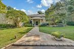 Set on 2 lush acres in the prestigious enclave of Old Westbury, this fully renovated residence combines modern luxury with timeless elegance. Offering three expansive levels of living space, the home is designed for both grand entertaining and relaxed everyday living.A dramatic double-height entry welcomes you into a light-filled open floorplan with soaring ceilings, walls of glass, and seamless indoor-outdoor flow. The chefâ€™s kitchen is a true showpieceâ€”fully outfitted with professional-grade appliances, oversized island, and sleek custom cabinetryâ€”opening to multiple living and dining spaces. A spacious home office provides the perfect environment for work-from-home comfort.The private quarters feature generously scaled bedrooms with spa-like bathrooms, while the lower walkout level is designed as a wellness and recreation haven. Enjoy a full gym, sauna, playroom, guest quarters, and staff/maidâ€™s room, all thoughtfully appointed for convenience and privacy.Resort-style amenities abound outdoors: a heated pool with spa, a private pickle ball/tennis court, and a dedicated playground create an unrivaled lifestyle experience. A 3-car garage completes the offering.Move-in ready and offered furnished, this exceptional estate presents a rare opportunity to own a turn-key retreat in one of Long Islandâ€™s most coveted neighborhoods.