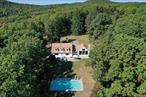 Travel to the end of this quiet country road to find this custom home privately situated on a beautiful 9 acre parcel. Perfectly sited, with stunning views of the Berkshires and Stissing Mountain, this unique offering will surely impress. This oasis is ideal for relaxation or entertaining complete with gunite pool, bluestone patio and lush landscaping. Enter into the home to be greeted by a stunning great room with soaring ceiling, impressive stone fireplace, wide plank flooring and a wall of windows with fully integrated blinds to either provide total privacy or an abundance of natural light. Kitchen with stainless appliances & Subzero refrigerator flows seamlessly to formal dining room, creating an exceptional venue for dinner parties with family & friends. Extremely versatile floor plan includes three first floor bedrooms, ideal for guest quarters or office space, serviced by a tastefully renovated bathroom complete with tile shower. Head upstairs to find a large den/office for peaceful relaxation or uninterrupted desk work. Second floor also includes a massive primary suite with sitting area, large walk-in closet & ensuite bathroom. The primary suite overlooks the yard, pool & valley with mountain views, creating the most inviting environment to awake to each morning. Conveniently located second floor laundry room complete with dog wash station. Recent improvements include driveway, ductless units for heating & cooling,  new water heater, new pool pump & filter, flooring & fresh paint throughout. Heated two car garage for abundant storage. Incredibly private and secluded yet just minutes from Pine Plains for exceptional dining & shopping and an easy commute via Taconic State Parkway in close proximity. Ideal as a primary residence or weekend retreat.