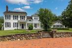 Now for rent is one of Quaker Hill&rsquo;s most prestigious estate homes. The main estate at Kirby Hill Farm is available as a year-round, or seasonal winter rental, impeccably furnished and equipped residential rental with an in-ground pool. Set on close to 250 acres and one of the region&rsquo;s finest equestrian facilities. The circa 1860 colonial farmhouse boasts 3, 942 square feet. There are two separate parlor rooms on the first floor both with fireplaces, along with a formal dining room, a well-appointed kitchen with a fireplace, additional dining area, convenient first floor laundry room and two powder rooms, with one that can be accessed from the patio and pool area. Above is the primary suite with a fireplace, multiple walk-in closets, sitting room, office area and full bath, two additional bedrooms and full bath. Be sure not to miss the third floor that is currently set up as a sleeping loft with full bath. Outdoor amenities include an inground pool, patio area, fire pit, covered porch and ample yard space for recreation. This rental also has shared use of the tennis court with the neighboring carriage house. As a rental on the grounds of Kirby Hill Farm, additional amenities could include boarding, riding, lessons, or simply spectating at a polo match. Inquire about pets and the potential to rent for a shorter duration. The tenant will be responsible for oil, propane, electric, Comcast/Xfinity business internet/cable and must provide tenants insurance. The landlord provides lawn, snow, pool maintenance and garbage. Just minutes to the quaint Village of Pawling with charming boutique shops, fun eateries, fine dining and seasonal farmer&rsquo;s market. With the Pawling Metro North Train Station just 5 miles away, you are just 90 minutes to NYC by train.