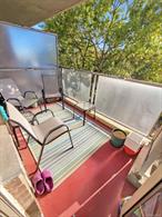 This bright and inviting two-bedroom residence offers a rare combination of space, convenience, and outdoor living. The home features a beautifully updated kitchen, an expansive living room, and two generously sized bedrooms. Step out onto the private patio to enjoy fresh air and relaxing views. Immediate on-site parking is available for just $50 per month. Perfectly located near Gateway Mall for endless shopping and dining options, the building sits right off the highway with a bus stop at the entrance, making commuting effortless.