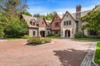 Hidden Gem â€“ A Timeless Tudor Masterpiece on 2.7 Acres. Tucked away down a serene private road in the prestigious Village of Great Neck, this hidden gem is a 11, 000-square-foot Tudor mansion, custom built in 2009 with the highest level of craftsmanship and attention to detail. A striking exterior of hand-cut stone and arched leaded-glass windows evokes the grandeur of old-world architecture, while the interior is thoughtfully designed for todayâ€™s modern lifestyle. The grand entry foyer sets the tone for this stately residence, flowing seamlessly into expansive entertaining spaces. A formal living room and elegant dining room with butlerâ€™s pantry provide the perfect setting for sophisticated gatherings, while the state-of-the-art chefâ€™s kitchen with double appliances, custom cabinetry, and a sunlit breakfast room caters to both grand entertaining and everyday living. This residence is designed with both comfort and elegance in mind, offering 7 ensuite bedrooms and 2 additional guest suites. The lavish master wing is a true retreat, complete with a private sitting room and fireplace, two walk-in closets, and a spa-like marble bathroom featuring a soaking tub and oversized shower. The walk-out lower level is an entertainerâ€™s dream, boasting soaring ceilings, a custom catering kitchen that doubles as a pool cabana, and vast flexible space for recreation, fitness, or entertaining on a grand scale. Outdoors, the estate is equally impressive. Set on over 2.7 acres of professionally manicured grounds, the property offers a resort-like lifestyle with a sparkling in-ground swimming pool, separate jacuzzi, expansive covered patio with a large stone fireplace, and multiple areas for lounging and dining al fresco. A three-car garage and sweeping driveway complete this extraordinary offering. This hidden gem combines timeless Tudor architecture with modern luxury amenities, offering a true Gold Coast masterpiece for those who value elegance, privacy, and unparalleled comfort.