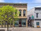 Step into a piece of Middleburgh History. The beloved Conglomerate, an 1887 architectural treasure, is available for sale as its dedicated owner retires. 1st floor boasts 2390 sq ft with kitchen, custom built ins with lighting, loft area, propane heat, half bath and two mini splits. Upstairs the 1760 sq. ft. loft is an expansive, inspiring open space with wide plank floors, propane heat, removable stage and half bath. Natural light floods this space and every inch reflects pride of ownership. There&rsquo;s stairs to attic storage and roof access, standing seam metal roof. This building has timeless character blended with modern functionality and is ready to continue as retail space or bring your vision to life in this thriving village. This building is ready for the next chapter. Located in the village of Middleburgh in Schoharie County.