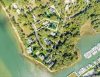 Water view on Three Mile Harbor! Enjoy the Endless Western Sunsets! Overlooking a preserve and next to the harbor, this prime water view home is on a permanently protected waterfront preserve. This quiet residential enclave is located across from a permanently protected preserve. As you face West over Three Mile Harbor, you are also adjacent to East Hampton&rsquo;s finest marinas and restaurants. Perfect as a forever home or great for a builder or investor with shy .7 acres of useable land. Set on a beautifully landscaped parcel, filled with specimen trees for maximum privacy, the house features endless sunsets, water views, and exceptional light and space. On the lower level there are three bedrooms, two baths, and media/family room. The second floor has a large living/great room, master suite and beautifully crafted kitchen with cherry wood cabinetry and granite counter tops. A large waterside deck off the living room is a gateway to all the activities of the harbor and a feast of magnificent sunsets. A 20 x 40 heated pool with ample decking, CAC and full basement add more comfort and beauty of the property. Rare and unusual, come take a look.LESS ?