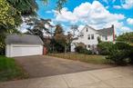 Welcome to 52-50 Little Neck Parkway, a spacious and well-maintained single-family home located in the heart of Little Neck within Queens School District 26. Offering 4 bedrooms, 1.5 baths, and approximately 2, 502 square feet of living space, this residence sits on an oversized 76 x 119 lot, providing both comfort and opportunity for future customization. Upon entry, youâ€™ll find generously sized rooms with an inviting layout ideal for both everyday living and entertaining. The main level offers a bright living room with slider to the slate patio, a formal dining room with wood burning fireplace, and a large eat-in kitchen with plenty of potential to design your dream culinary space. Upstairs, four spacious bedrooms provide versatility for family, guests, or home office use. The primary bedroom offers 4 double closets. A full basement adds valuable storage and recreational possibilities, while the two-car garage with stairs to a loft, offers additional storage space. The expansive property presents endless opportunities â€” whether you envision a lush garden, outdoor entertaining, or future expansion. This homeâ€™s prime location offers close proximity to shopping, dining, major highways, and public transportation. With solid bones and classic charm, this property is the perfect canvas for a buyer seeking to create a personalized home in one of Queensâ€™ most desirable neighborhoods. Donâ€™t miss this rare opportunity to own a large residence on a substantial lot with excellent schools and conveniences at your doorstep.