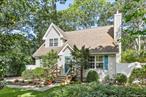 Welcome to this beautifully maintained 4-bedroom, 2-bathroom traditional home. Perfectly located south of the highway in Hampton Bays, this property offers both comfort and convenience with timeless charm. This home is a rare find as it has a full unfinished basement with 2-egress windows and a walk-out entrance. The first level features an open kitchen and living room with soaring ceilings, a wood burning fireplace, and an abundance of large windows that give the interior gorgeous natural light. On the same level, there are two large bedrooms and 1 full bath. On the second level, you will find one oversized bedroom with unique front and back windows creating a large versatile space, as well as a full bath and an additional bedroom and walk in linen closet. The outside offers 2 private side yards complete with kitchen access, a tranquil patio space and an outdoor shower. This home is truly turnkey with the opportunity to customize and make it your own!