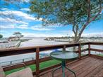 Enjoy stunning bay views from this 1 bed , 1 bath end unit condo at The Anchorage community in Copiague. This is a rare end unit on the 2nd floor featuring spectacular south facing views of the bay. Watch the boats go by as you sip your morning coffee or entertain guests. Resort style living includes in ground pool, state-of-the-art-clubhouse, tennis/pickleball, and bocce ball courts. Boat Slips are available for a fee.