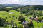 Perched above the bucolic rolling hills of Millbrook Hunt Country, framed by panoramic views of the Catskill mountains sits an idyllic country retreat and extraordinary equestrian estate encompassing 185 ultra-private acres. Once the cherished estate of Margaret Carnegie, only child of Andrew Carnegie, a rich legacy of elegance and prestige is preserved and embraced throughout this iconic property. Originally constructed in 1865 has been thoughtfully expanded with sophisticated living spaces and abundant opportunities to entertain throughout. This residence masterfully unites historic grandeur with modern luxury, and the warmth and charm of yesteryear. The main residence showcases timeless refinement: a richly paneled library with cozy fireplace, an elegant formal dining room to host 30 of your dearest guests, and a grand living room with soaring ceilings and French doors opening to the terrace to watch the sunset and the everchanging views of the Catskills. At the heart of the estate, a world-class equestrian facility designed by acclaimed French architect Atelier Choiseul features state-of-the-art stables, paddocks, a tack room, staff housing, and a refined lounge. A hunter trial course completes the unparalleled amenities for horse enthusiasts. With miles of fenced pastures, private riding trails, sparkling ponds, and unmatched tranquility is just minutes from the Village of Millbrook and within 90 minutes of Manhattan. The magnificent grounds and estateâ€™s vast acreage allows for the quintessential pastoral experience, and leave ample room for additional recreational pursuits. This ultra-private retreat offers the best of both worlds: the sophistication of country living alongside access to the Millbrook Hunt, Mashomack Polo, Sandanona and the regionâ€™s most prestigious pursuits. With 185 acres, the estate also presents endless possibilities to expand whether creating additional residences for a family compound, designing new equestrian amenities, or shaping the land into a visionary retreat tailored to future generations. This is more than a residence, it is a legacy property offering unmatched privacy, historic provenance, and the ultimate expression of Hudson Valley luxury ready to elevate the sense of exclusivity.