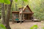 Deep in the quiet woods of Willow, where trout streams wind and songbirds keep watch, sits a hand-built home that feels lifted from a storybook. Originally constructed in 1977 and fully restored with additions in 2020, Cross Patch Cabin is a rare Woodstock retreat that blends rustic character with modern comforts. Set on nearly four acres across two wooded parcels with more than 400 ft of stream frontage, the property offers both privacy and flexibility: enjoy the existing cabin as a hideaway or build a second home on the adjoining lot while keeping Cross Patch Cabin as a guesthouse. The cottage has been reimagined with intention: a wraparound porch that frames the forest, a warm living area with a wood-burning stove, and two bedrooms with a new full bath. The lower level provides storage and laundry, while modern infrastructure including an artesian well, all new plumbing and electric, new septic, on-demand hot water, and a full-house generator ensures effortless living. Outdoors, an open-air shower, fenced yard, and seasonal mountain views complement the wooded setting. Just minutes from Woodstock&rsquo;s center and the Catskills&rsquo; trailheads, Cross Patch Cabin offers quiet privacy with modern convenience, ideal as a full-time residence or weekend retreat.