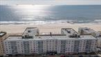 Spacious & Sunlit Junior 4 WITH DEDICATED PARKING, featuring a unique layout, in a premier Long Beach Oceanfront building! Perfectly priced and perched on the 6th floor, this updated, modern unit offers a bright, open layout. Enjoy sweeping city views, picturesque Long Beach vistas, and magical summer sunsets right from home. Inside, youâ€™ll find ceiling fans, abundant closet space and a versatile floor plan allowing for a flexible dining area, office, or guest space. Dedicated parking is included for ultimate convenience! This sought-after oceanfront building offers unparalleled amenities: a heated 22-yard oceanfront pool, a large and fully equipped gym, a party room with a full kitchen, storage for bikes, surfboards, beach chairs, and umbrellas, plus direct access to the boardwalk and Atlantic Ocean. Thereâ€™s even a secure package room with video monitoring â€” including handling of returns. Experience the best of Long Beach living with comfort, style, and unbeatable location just moments from the sand.