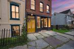 Located in the heart of Newburghâ€™s Historic District, this fully leased three-story mixed-use building on an expanded lot includes a commercial storefront, a garden-level studio, and two full-floor residential apartments. The first floor features a storefront suitable for retail, office, or studio use. Toward the rear is a spacious hallway that leads to the backyard, a shared laundry room, and access to the garden-level studio. The studio also has a private exterior entrance and features soaring ceilings, offering versatility for living or work space. The second and third floors each contain a two-bedroom, one-bath apartment. Both residential units feature an open kitchen, dining, and living area with oak flooring, walk-in closets, and Energy Star stainless steel appliances. The top-floor bathroom includes a skylight that brings in natural light. Outdoor amenities include a shared patio area and backyard, along with off-street parking. There is also remains of a 3 car garage that could be rebuilt for additional income. The property is located near local restaurants, shops, public transportation, and the waterfront, within one of Newburghâ€™s architecturally rich neighborhoods. This is a mixed use building, ideal for investors - tenants are all on 12-24 month leases and all pay on time. Actual Rent Roll: Storefront â€“ $600/month, Studio â€“ $1, 745/month, Unit #2 â€“ $2, 100/month, Unit #3 â€“ $1, 800/month. Gross income approx. $75, 000, Net Income approx. $50, 000.