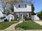 What a lovely upgraded single dwelling, ideally located in a very nice and quiet neighborhood, which offers a bright living room at the front, one bedroom and one full bath in the middle, one large open kit., and one formal dining room at the back. Walking up stairs, there are 3 large bedrooms, and one rest area, and one full bath. ***Finished basement with a family room and 2 storage rooms, and 0.5 bath. ***Oil heating has been changed to gas for both cooking and heating. 4 bedrooms, 2.5 baths. Open kit. and dining area. Private driveway for 4 cars. Maintained well with care. Close to the community mall, school, and easy access to major highways. A great opportunity of investment or living together with family members.