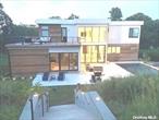 This absolutely stunning contemporary home is the perfect place for your North Fork getaway! Features galore include a chef&rsquo;s dream eat in kitchen, spacious living room with gas fireplace, and 3 available bedrooms. The first floor primary suite is enormous, with a soaking tub as well as shower in the gorgeous bathroom, plus a connected additional bedroom. The 2 guest suites, one with 2 queen beds, have their own beautiful bathrooms plus a there&rsquo;s a TV in every bedroom. Step out to the backyard paradise, with luxurious pool, cushy furniture, large dining table and firepit. Swim, relax, or enjoy the sunset at Iron Pier beach, just a block away, or visit the nearby farm stands or golf courses. You will not be disappointed!, Available off season and seasonal.