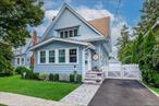 Nestled on an oversized 8, 400 sq ft lot in the heart of Malverne, this classic 3-bedroom Colonial offers the perfect blend of timeless character and modern convenience. Step inside to find beautifully maintained hardwood floors flowing throughout the home, adding warmth and charm to every room.The inviting living room features a cozy wood-burning fireplaceâ€”ideal for relaxing evenings or hosting guests. A bright and functional layout provides comfortable living space, while the generous lot offers endless possibilities for outdoor enjoyment, gardening, or future expansion.Additional highlights include a 1.5-car garage and an unbeatable location just moments from the vibrant Malverne shopping district, dining, parks, and public transportation.Donâ€™t miss this opportunity to own a piece of Malverneâ€™s charm!