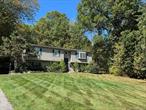 A home with great possibilities awaits you on its own private 1.9 acre homesite which borders on a forever green buffer. Features include central A/C, a furnace with 3 heating zones, and Andersen windows. The kitchen features an island, stainless appliances & quartz countertops. Hardwood flooring extends throughout the living room, dining room and hall. The bay window in the living room overlooks the sprawling front yard under a vaulted ceiling. The MBR suite includes a full bath, WIC & additional large closet. Spacious secondary BR&rsquo;s offer custom closets & ceiling fans. Lower level features a wonderful family room w/ woodburning stove & entertainment area, half bathroom & play room. This backyard is perfect for entertaining & includes a composite deck that extends the entire length of the house, above ground pool, and retaining walls. Desirable location, close to highways, schools & shopping.