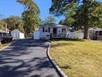 Welcome to this meticulously renovated four-bedroom, two-bathroom inline ranch situated in the East Patchogue area, South of South Country Road, offering convenient access to the Pine Neck Boat Ramp at the end of the block and nearby marinas and restaurants. The residence features a spacious living room with vaulted ceilings, dining area, eat-in kitchen, three bedrooms, and a large full bathroom with a skylight. The lower level boasts a large family room, laundry room, bedroom, one spare room, and a utility room with ample storage space. Additional amenities include separate thermostats, ceiling fans, a dehumidifier, shades/blinds, and a wrap-around deck accessible from the kitchen door, leading to a large deck and a spacious yard with a storage shed.