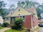Single-family Colonial style home. The property contains 2, 087+square spread over 3 levels, including a finished basement with interior and exterior access. The home is frame/brick construction with asphalt shingle roof, cedar shingles siding and double hung aluminum windows. The home consists of bedrooms, two full bathrooms, a kitchen with original appliances and a living room with an arched entry way and a wood burning fireplace. The property also boasts a detached 2 car garage. Some upgrades needed to uncover this gem. The property has a efficient layout to accommodate your growing family.