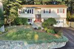 Beautifully updated 5-bedroom, 2-bath raised ranch located in the sought-after Village of Suffern. Set in a friendly neighborhood with a strong sense of community, this home is within walking distance (15 minutes) to local restaurants, shops, and village amenities.Interior highlights include recently refinished hardwood floors, full interior paint (2021), a completely remodeled kitchen with expansive counter tops, counter-height seating, custom under/upper cabinet lighting, and a new refrigerator (negotiable). Updated electrical panel (2021), fully renovated downstairs bathroom (2023), new washer (2025), and brand new central A/C system installed in 2024.The main floor features the prinary bedroom with custom board and batten and 2 additional bedrooms. The primary bath features a large skylight, tub/shower combo. Spacious living room with bay window overlooking the Ramapo Hills and custom board and batten detail. The dining area opens to the back deck through sliding glass doors, allowing for natural light throughout. Lower-level with den offers new laminate flooring and recessed lightingâ€”ideal for additional living space or a home office, 2 bedrooms and full bathroom newly renovated with tiled floors and glass shower. Exterior features include a paved driveway (2024), large shed, front yard sprinkler system, security system, and back deck with newly replaced railings and fully stained deck (2025). Permanent app-controlled lighting under eaves provides year-round decorative options. Step outside to a thoughtfully designed backyard, perfect for entertaining and relaxing. Stone/slate steps lead from the large back deck to a level yard featuring a built-in fire pit â€” the ideal space to unwind, host gatherings, or enjoy cool fall evenings under the stars.Conveniently located just 1 mile to NJ Transit and minutes from Good Samaritan Hospital. A must-see home offering turnkey living in a prime location!Additional Features:Water Heater (2019)Custom Kitchen and Bath RenovationsCommuter-Friendly Location