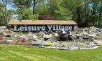 Leisure Village â€“ Baronet Model Condo For Sale â€“ Ridge, NY-Welcome to Leisure Village, a desirable 55+ gated community. This updated Baronet model ranch-style condo offers 2 bedrooms, 1 full bath, spacious living/dining room, and eat-in kitchen. Highlights include new laminate flooring throughout, enclosed sunroom, attached 1-car garage with interior access.Community amenities feature a clubhouse, 9-hole golf course, heated pool, fitness center, bocce, shuffleboard, and more. HOA covers lawn care, snow removal, exterior maintenance, and 24-hour gated security. Conveniently located near shopping, dining, and major roadways.Enjoy low-maintenance living and an active lifestyle in Leisure Village!
